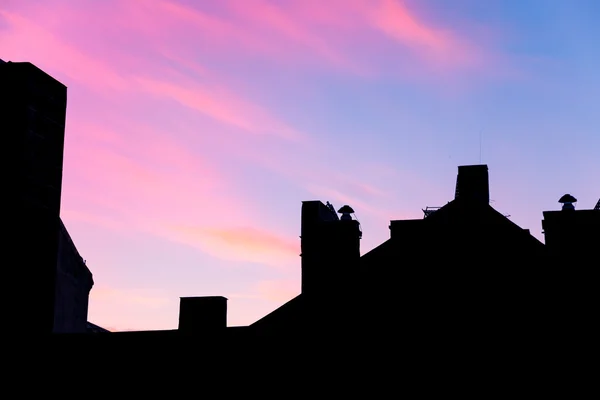 Silhouette of the roof with a blue and pink sky