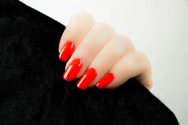 Woman's hand with red nails