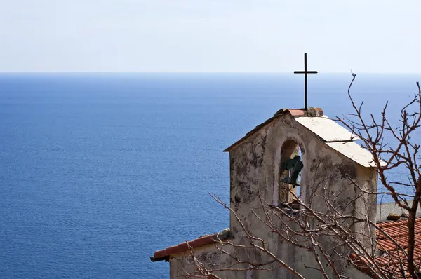 A bell tower, the sea and the sky