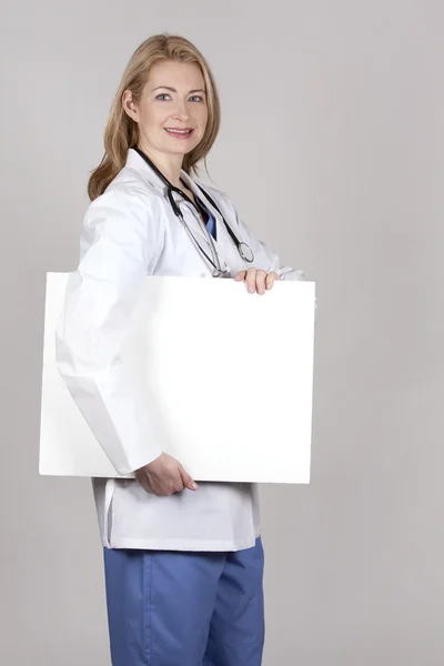 Doctor with board