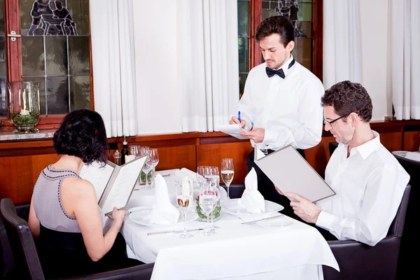 Man and woman in restaurant for dinner