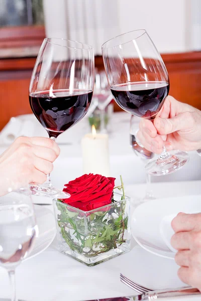 Couple drinking red wine in restaurant