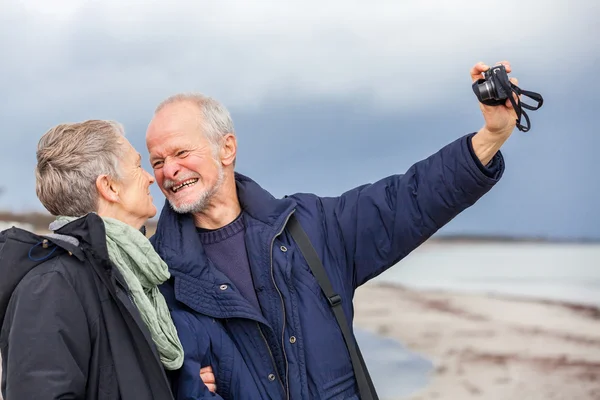 Elderly couple taking a self portrait