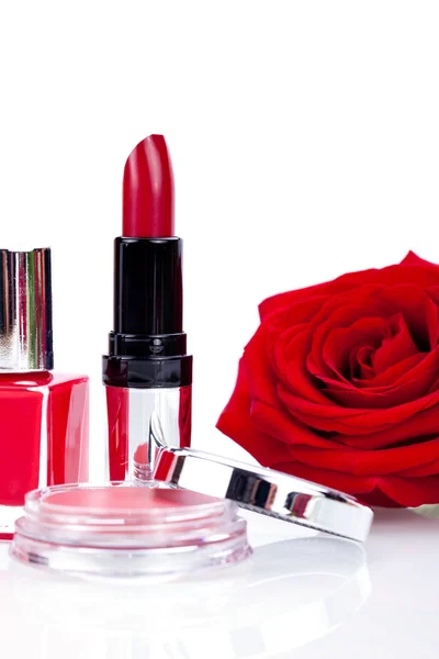Fashionable cosmetics with red rose