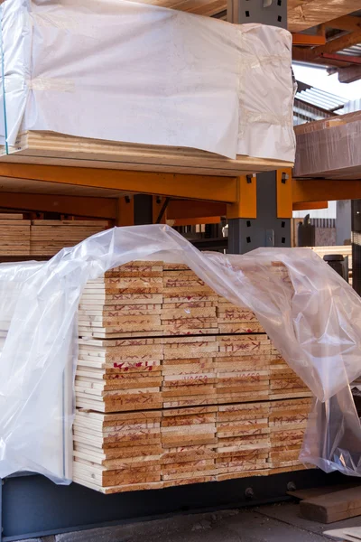 Wooden panels stored inside a warehouse