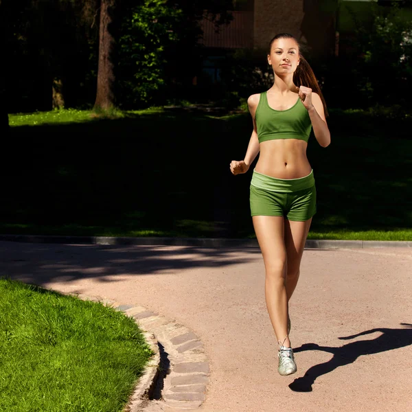 Woman Runner. Fitness Girl Running outdoors