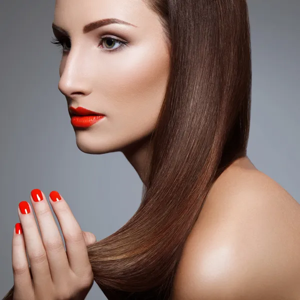 Beautiful Woman With Red Nails. Makeup and Manicure. Red Lips