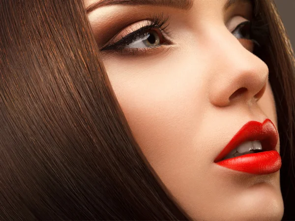 Woman Eye with Beautiful Makeup. Red Lips. High quality image.