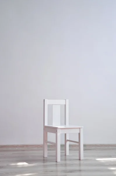 White chair in an empty room