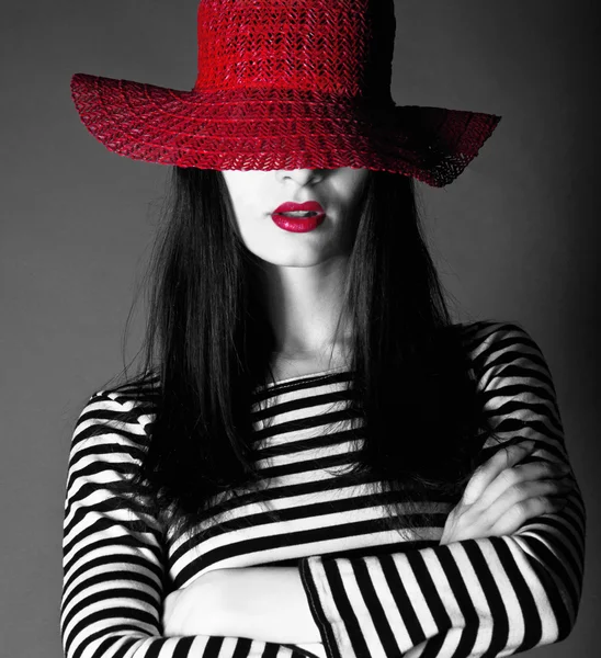 Sexy girl in a red hat with red lips