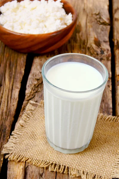 Dairy products on wooden background.