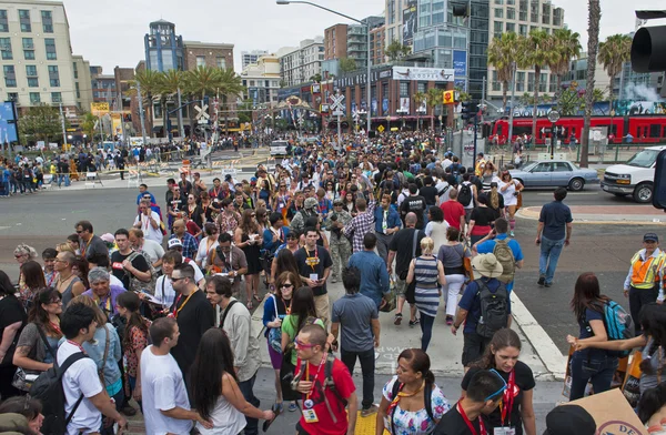 SAN DIEGO, CALIFORNIA - JULY 13: Crowds of participants cross the street in the gaslamp district while at Comicon in the Convention Center on July 13, 2012 in San Diego, California.