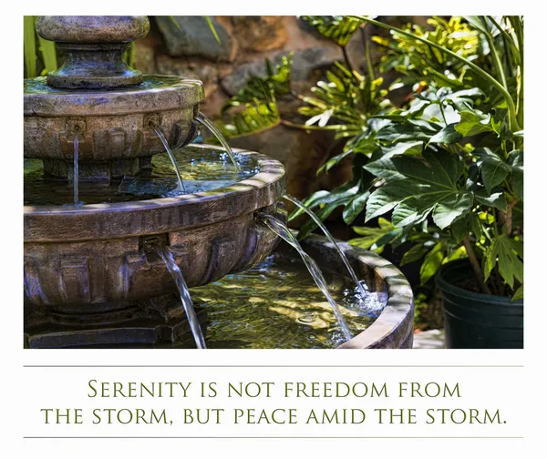 A decoratie stone fountain in a garden and quote about Serenity