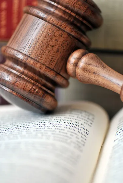 Wooden gavel atop literature