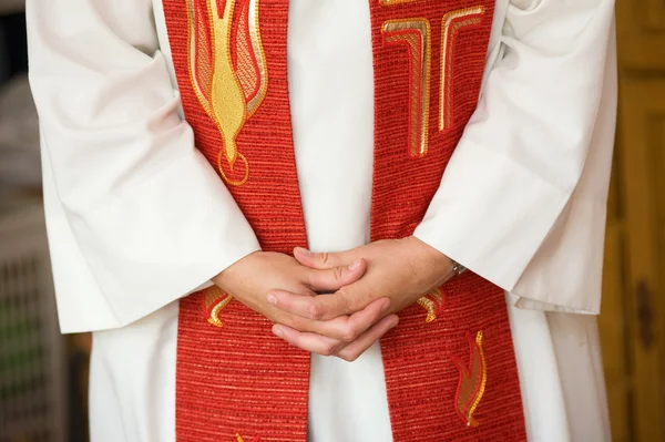 Hands of female priest