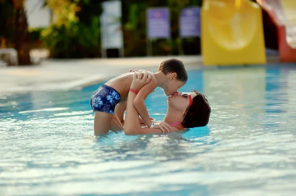 Mom and son in the pool