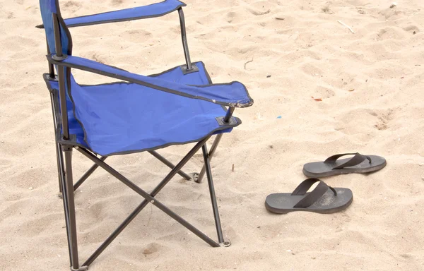 Folding chair and slippers.