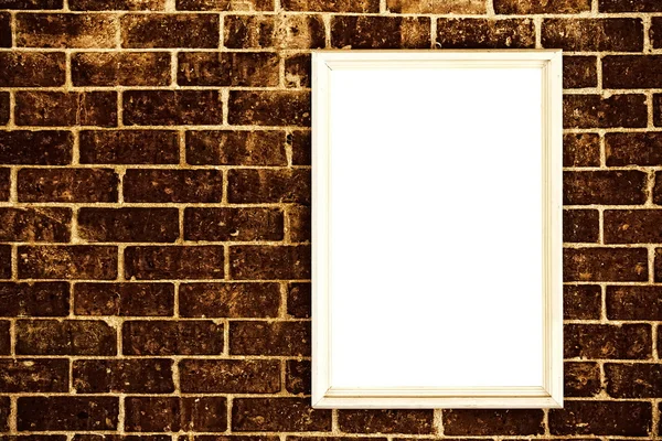 Blank frame on brick wall