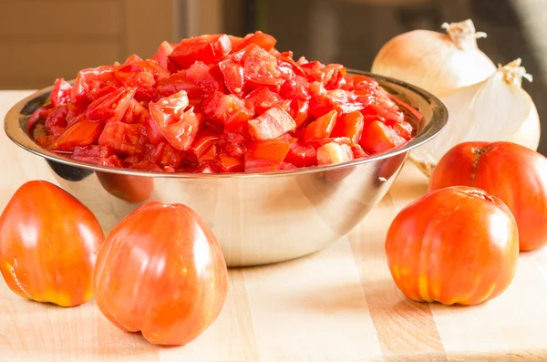 Tomatoes and bowl of diced tomatoes