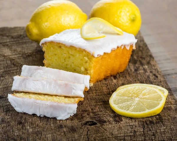 Sliced lemon pound cake with white icing