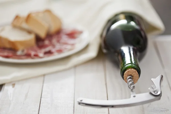 Wine bottle with ham