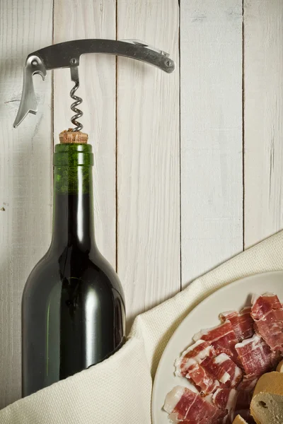 Wine bottle with ham