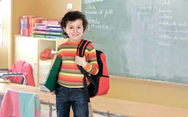 Student boy with a red backpack