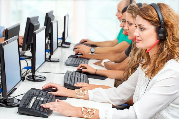 Young business people working on computers.