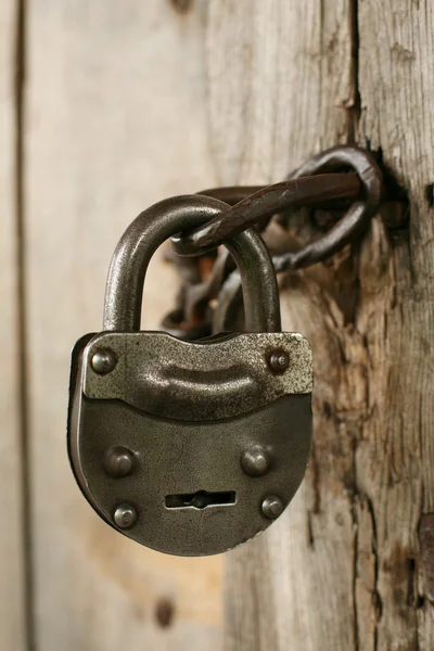 Vintage padlock on an old door