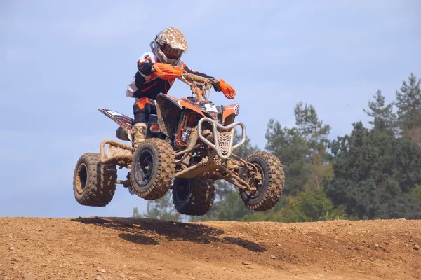 Teen rider in jump above the horizon