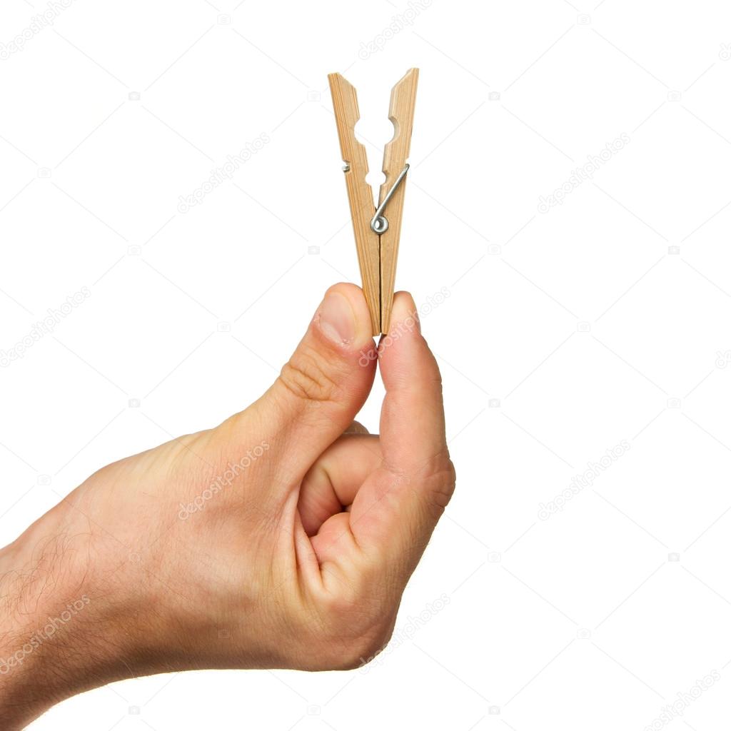 Hand holding clothes peg — Stock Photo © michaklootwijk 12501564