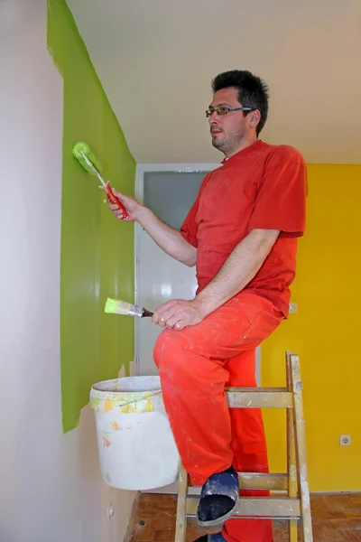 Painter in action, interior decoration