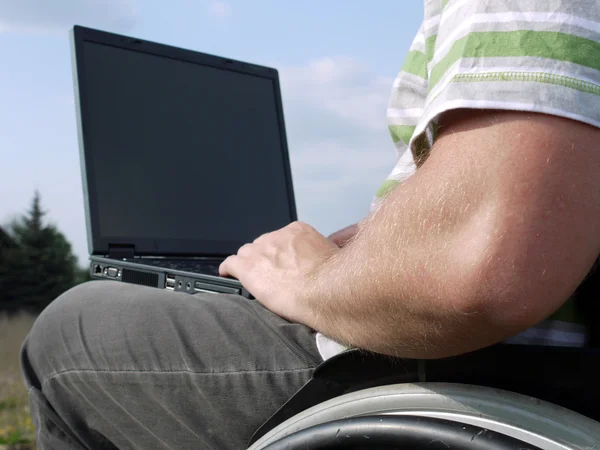 Handicapped man with laptop