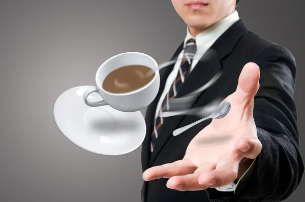 Businessman give to you the coffee cup