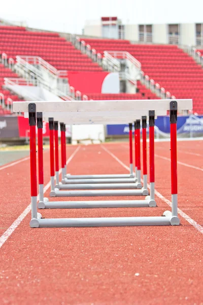 Hurdles on the red running track