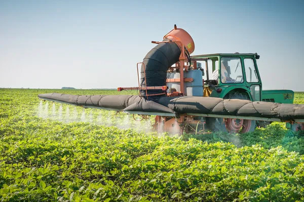 Tractor spraying pesticides