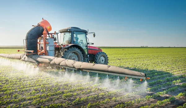 Tractor spraying pesticides