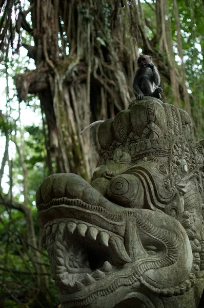 Sculpture in Holy Monkey Forrest with monkey on top