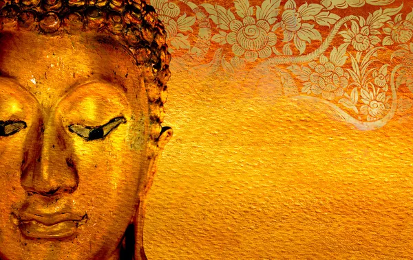 Buddha gold statue on golden background .