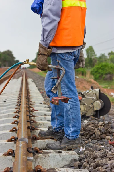 Workers preparing equipment for maintenance of the railway-Edit.