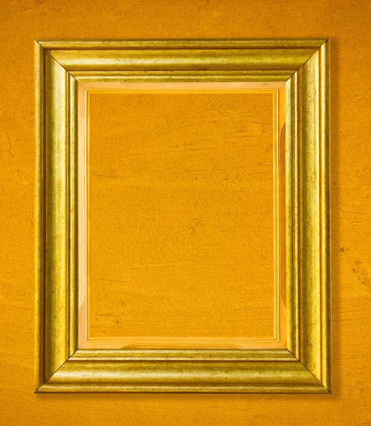 Wooden golden picture frame on cement