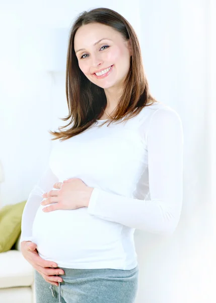 Pregnant Young Woman at home. Healthy Pregnancy