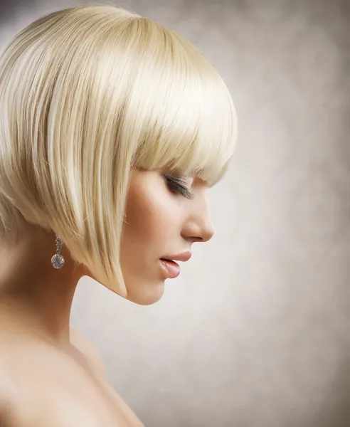 Haircut. Beautiful Girl with Healthy Short Blond Hair. Hairstyle