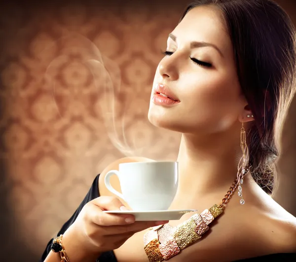 http://st.depositphotos.com/1491329/1413/i/450/depositphotos_14134477-Beautiful-Woman-With-Cup-of-Coffee-or-Tea.jpg
