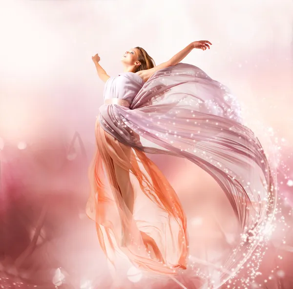 Fairy. Beautiful Girl in Blowing Dress Flying. Magic