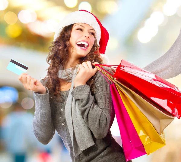 Christmas Shopping. Girl With Credit Card In Shopping Mall.Sales