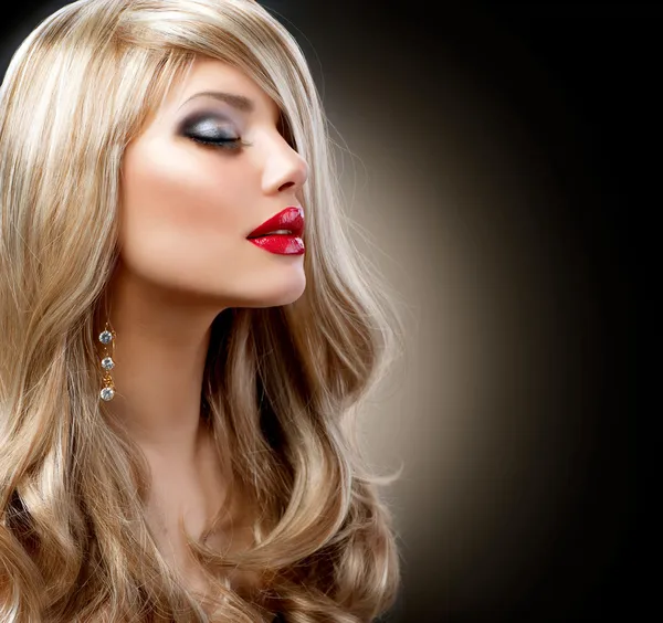 Beautiful Blond Woman with Holiday Makeup over Black