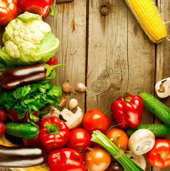 Healthy Organic Vegetables on a Wood Background