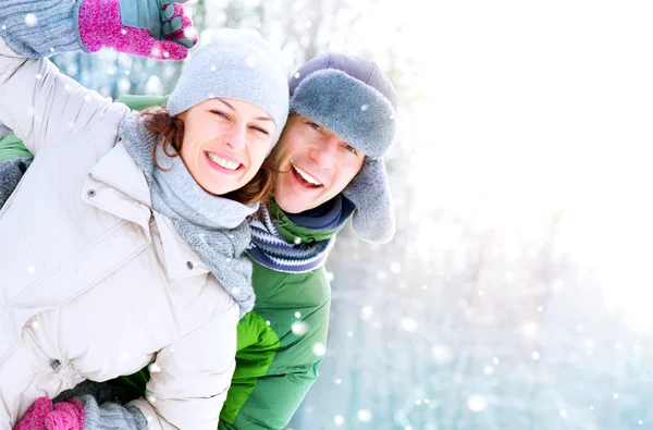 Happy Couple Having Fun Outdoors. Snow. Winter Vacation