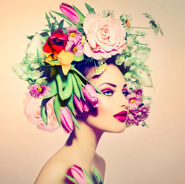 Spring Woman. Beauty Girl with Flowers Hair Style